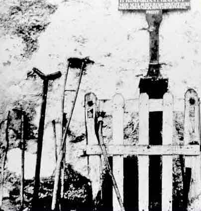 Wynne Collection of photographs showing Knock in 1879, Crutches left at gable wall by people cured at Knock, 1879 