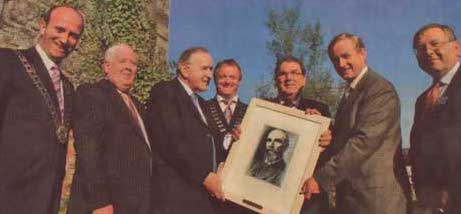 Members of the Humbert Summer School present a picture of Davitt to John Hume, Enda Kenny and Albert Reynolds.